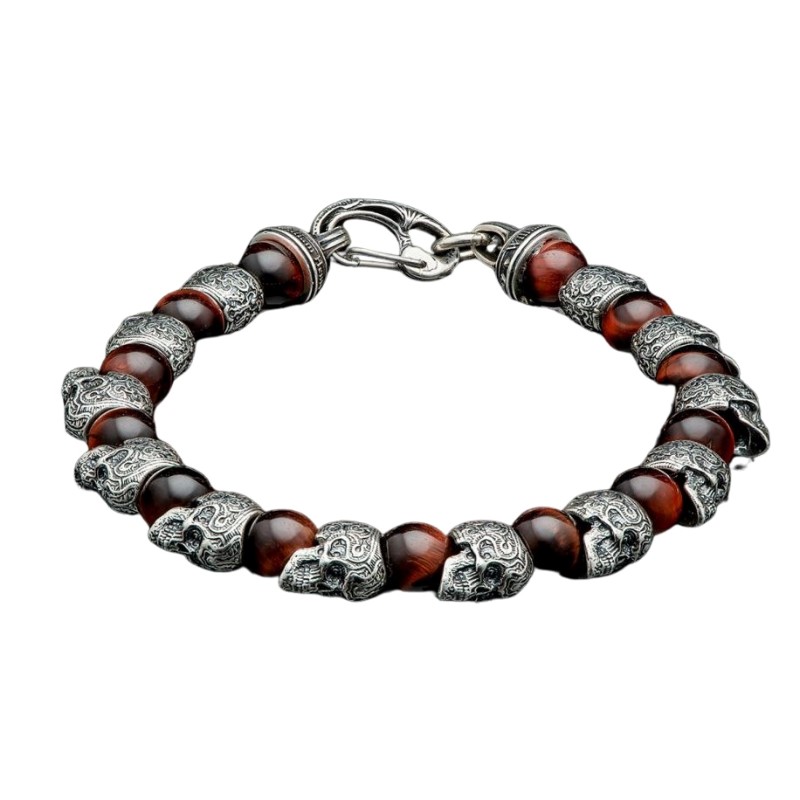 William Henry Motivation Skull Bracelet.This Piece Is Built On Aircraft Grade Stainless Steel Cable Featuring Red Tiger Eye Beads Offsetting The Sculpted Sterling Skulls Arount The Wrist